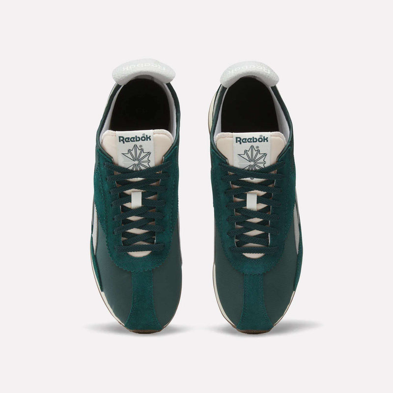 A pair of dark green Reebok R400 Shoes with white accents, seen from above. The Reebok logo appears on the white tongue. Black laces and light brown outsoles give these retro sneakers a classic look.