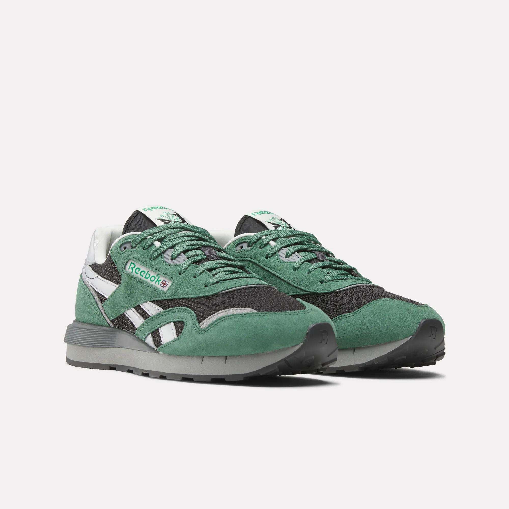 A pair of Reebok Classic Nylon 89 Shoes in green and black with white accents, featuring a lace-up closure, classic design, and the Reebok logo on the side and tongue, shown on a plain white background.