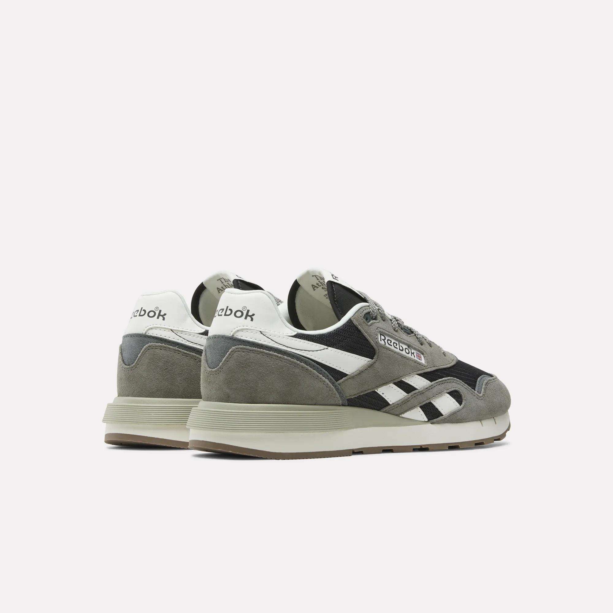A pair of Reebok Classic Nylon 89 Shoes in gray, black, and white are displayed on a plain white background, angled with the heels forward and toes outward.