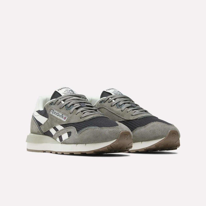 A pair of Reebok Classic Nylon 89 Shoes featuring gray suede and mesh uppers, white and black side stripes, white midsoles, and gum rubber outsoles are displayed side by side on a plain white background.