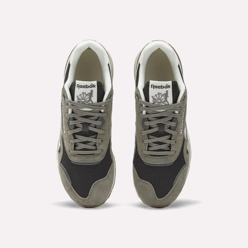 A pair of Reebok Classic Nylon 89 Shoes seen from above, with gray suede overlays, black mesh panels, white midsoles and interiors. Each heritage sneaker displays the Reebok logo on the tongue.