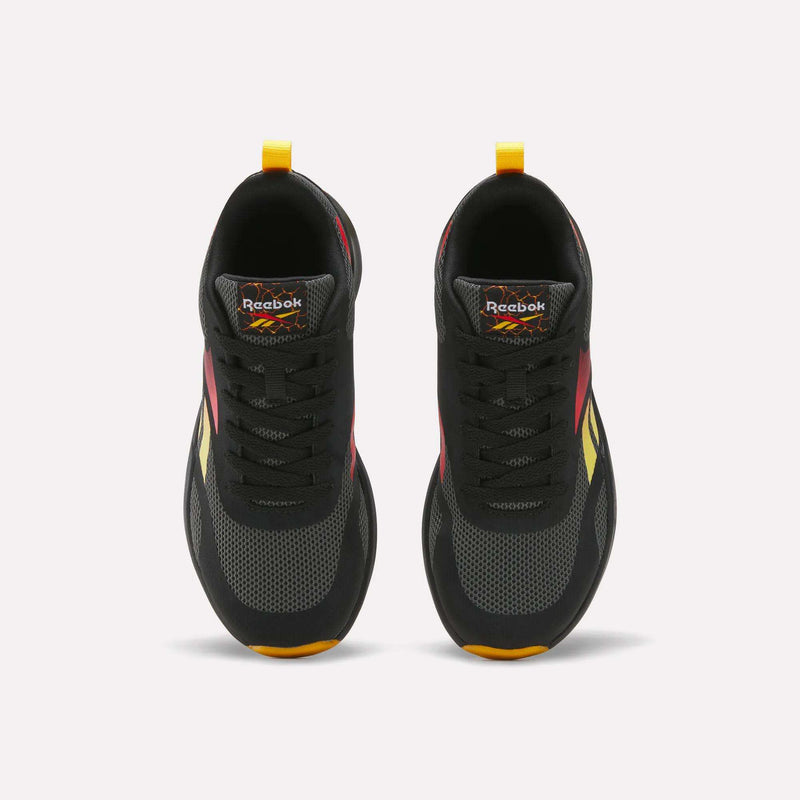 Top view of a pair of Reebok Energen Running Shoes for little kids in black with red, yellow, and orange accents, black laces, and yellow heel pull tabs. These shoes feature a cushioned midsole for added comfort and are positioned side by side on a white background.