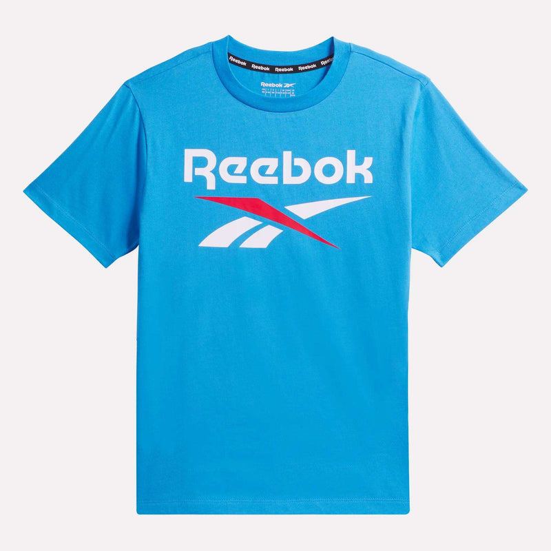 The Kids' ID Big Logo Tee by Reebok is a bright blue, all-cotton boys' short-sleeve shirt featuring the white Reebok logo and name with a bold red arch on the front.