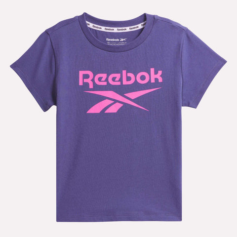 The Reebok Kids' ID Big Logo Tee is a purple short-sleeve all-cotton jersey t-shirt for girls, featuring the pink Reebok logo and name across the chest.