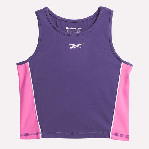 The Reebok Kids' Lux Tank is a stretchy, sleeveless activewear top with a purple front and back, pink side panels, white piping, and the Reebok logo printed in white on the chest.