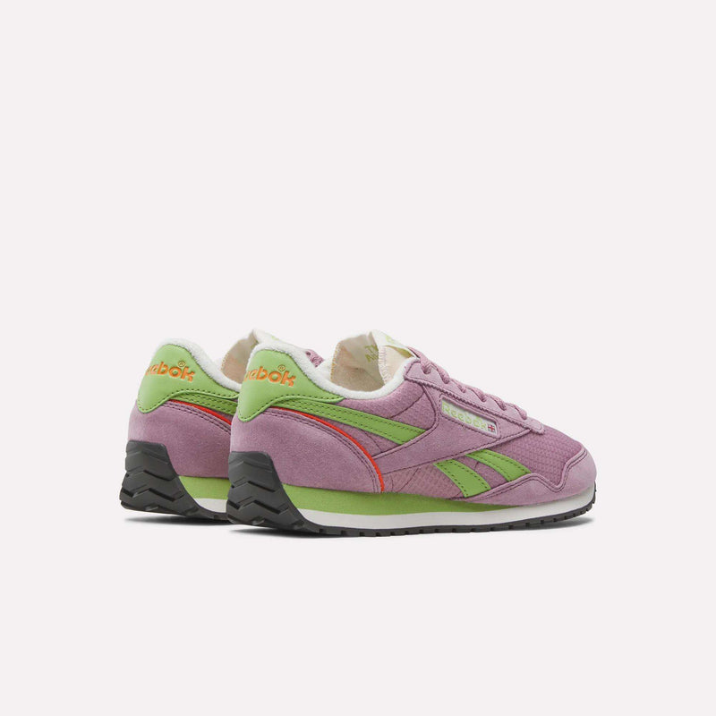 A pair of Women's Classic AZ Shoes by Reebok, featuring purple suede, green and red accents, white midsoles, black outsoles, and green Reebok branding on the heel—showcasing retro running style against a plain white background.