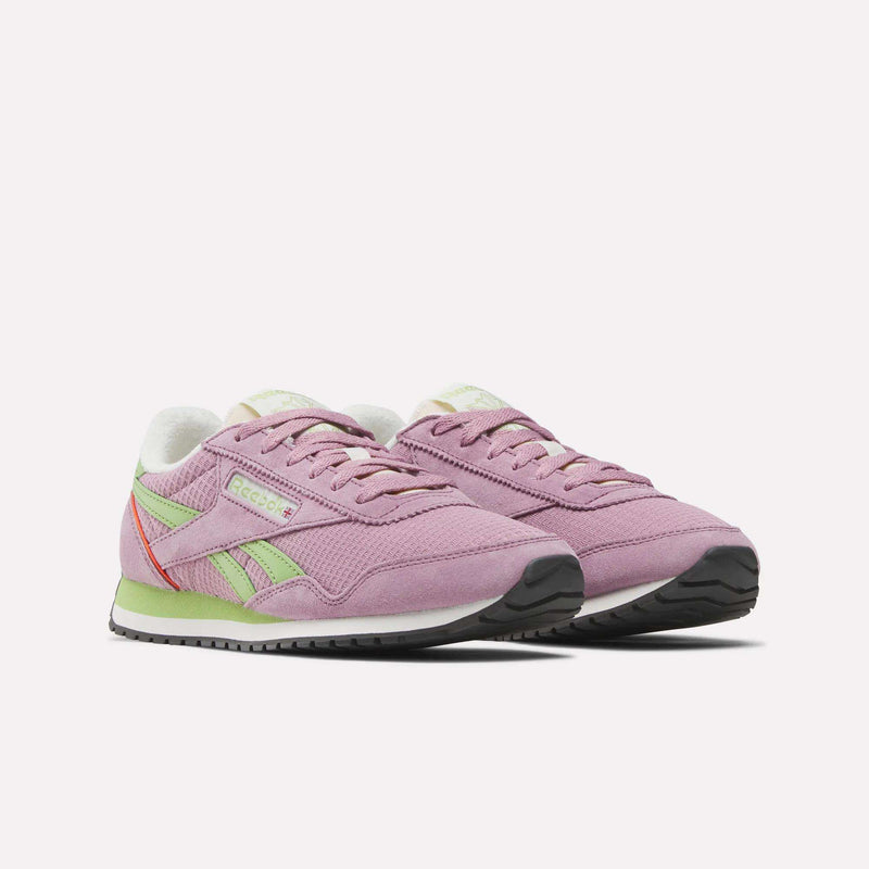 The Reebok Women's Classic AZ Shoes feature pink uppers with green and coral accents, white midsoles, and black outsoles for a retro running look, showcased on a white background.
