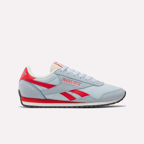 The Women's Classic AZ Shoes by Reebok feature a light blue design inspired by Reebok heritage, with red accents, white laces, and a black sole. Shown in side profile on a plain white background.