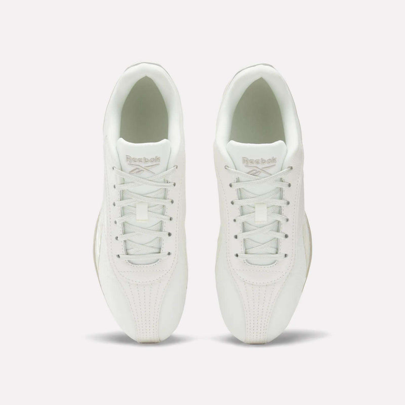 Top view of Women's Ultra Lo Shoes by Reebok in white, featuring white laces and Reebok branding on the tongues. The low-profile, minimalist shoes are placed side by side on a plain white background.