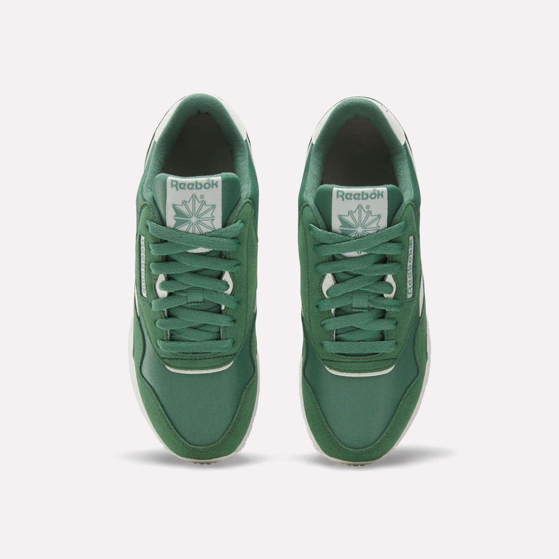 Reebok Women's Classic Nylon Shoes in green feature retro style, white logos on the tongues and sides, white midsoles, and green laces—crafted from nylon and suede for timeless appeal.