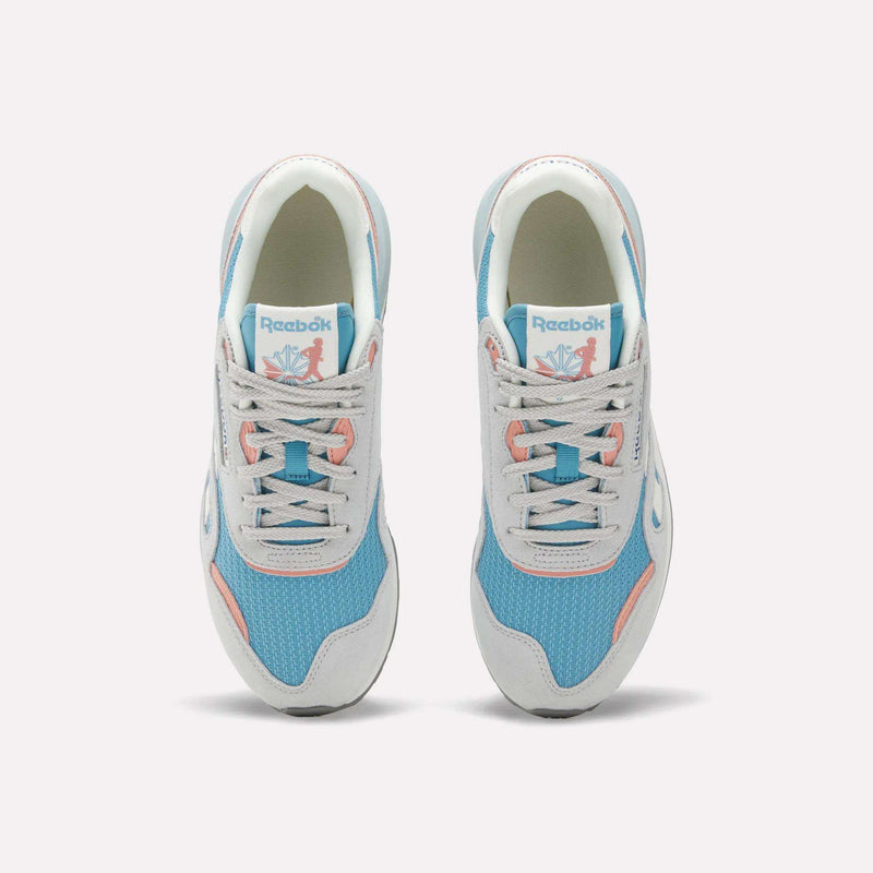 The Reebok Women's Classic Nylon 89 Shoes, seen from above, feature light blue mesh, white overlays, light gray laces, pink accents, retro style details, and the Reebok logo on the tongue.
