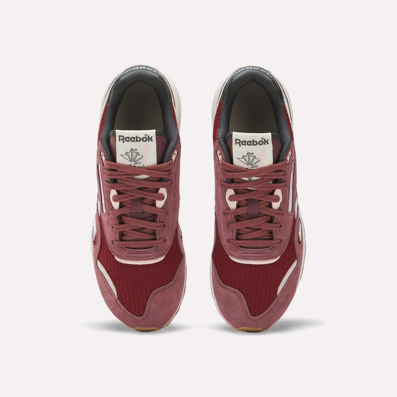 A pair of Women's Classic Nylon 89 Shoes by Reebok in maroon with white accents is shown from above on a plain white background, featuring retro mesh and suede materials and the Reebok logo on the tongue.