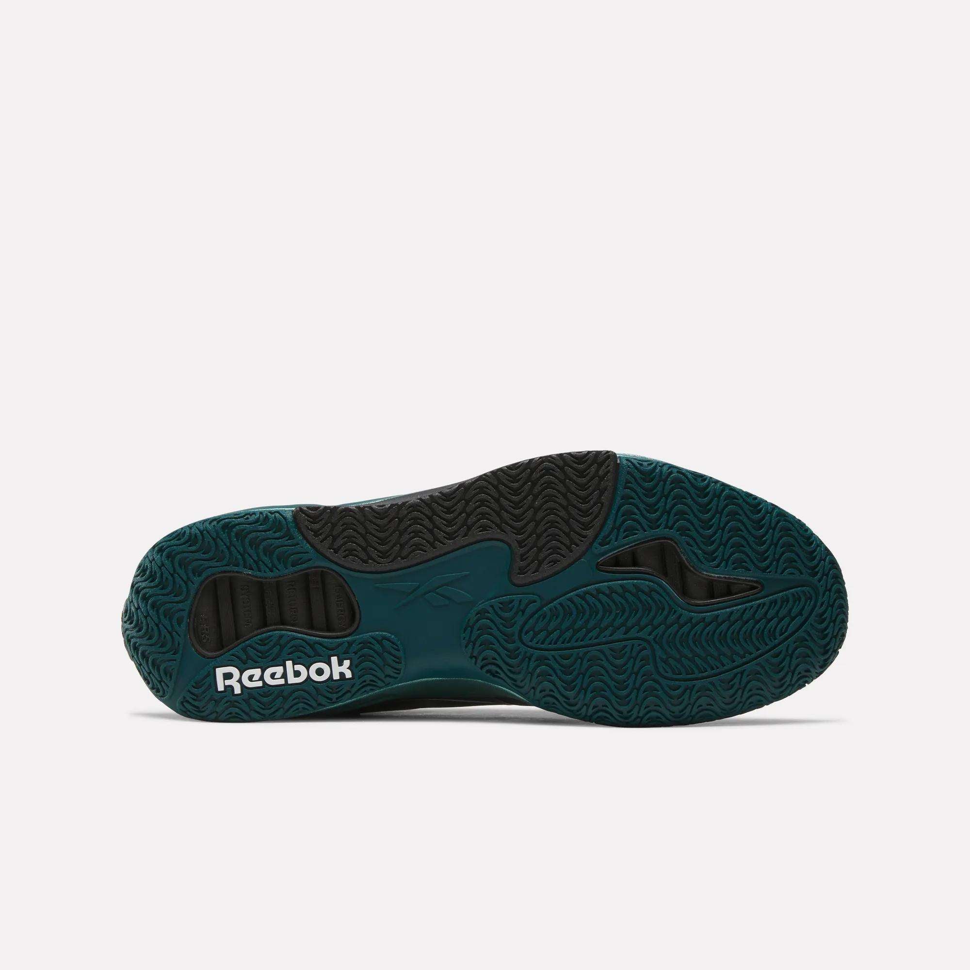 The image shows the dark green and black outsole of the Reebok Engine A Basketball Shoes, with wavy textured patterns for grip and a white Reebok logo—highlighting the advanced ERS technology found in these sneakers.