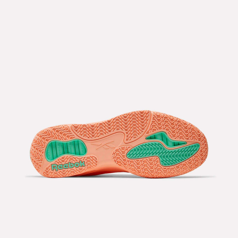 The Engine A Basketball Shoes by Reebok feature an orange sole with green accents, the Reebok logo, textured grip patterns, and ERS technology for better energy return on the court.