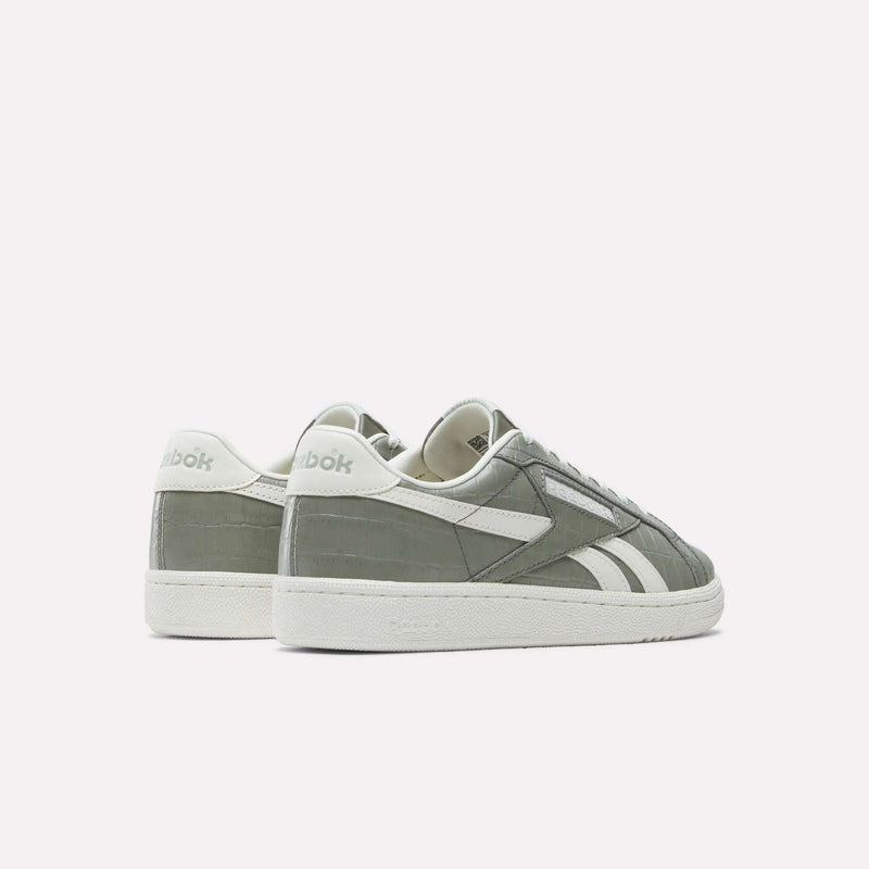 A pair of Reebok Women's Club C Grounds UK Shoes in gray and white premium leather, featuring the brand logo on the heel and side, displayed on a white background with one shoe slightly behind the other.