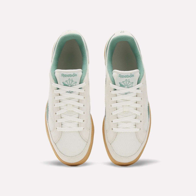 Top view of Reebok Club C Grounds 70 Shoes in white with mint green accents, white laces, and gum soles. Inspired by the '70s, these sneakers feature premium suede details and are displayed side by side on a plain white background.