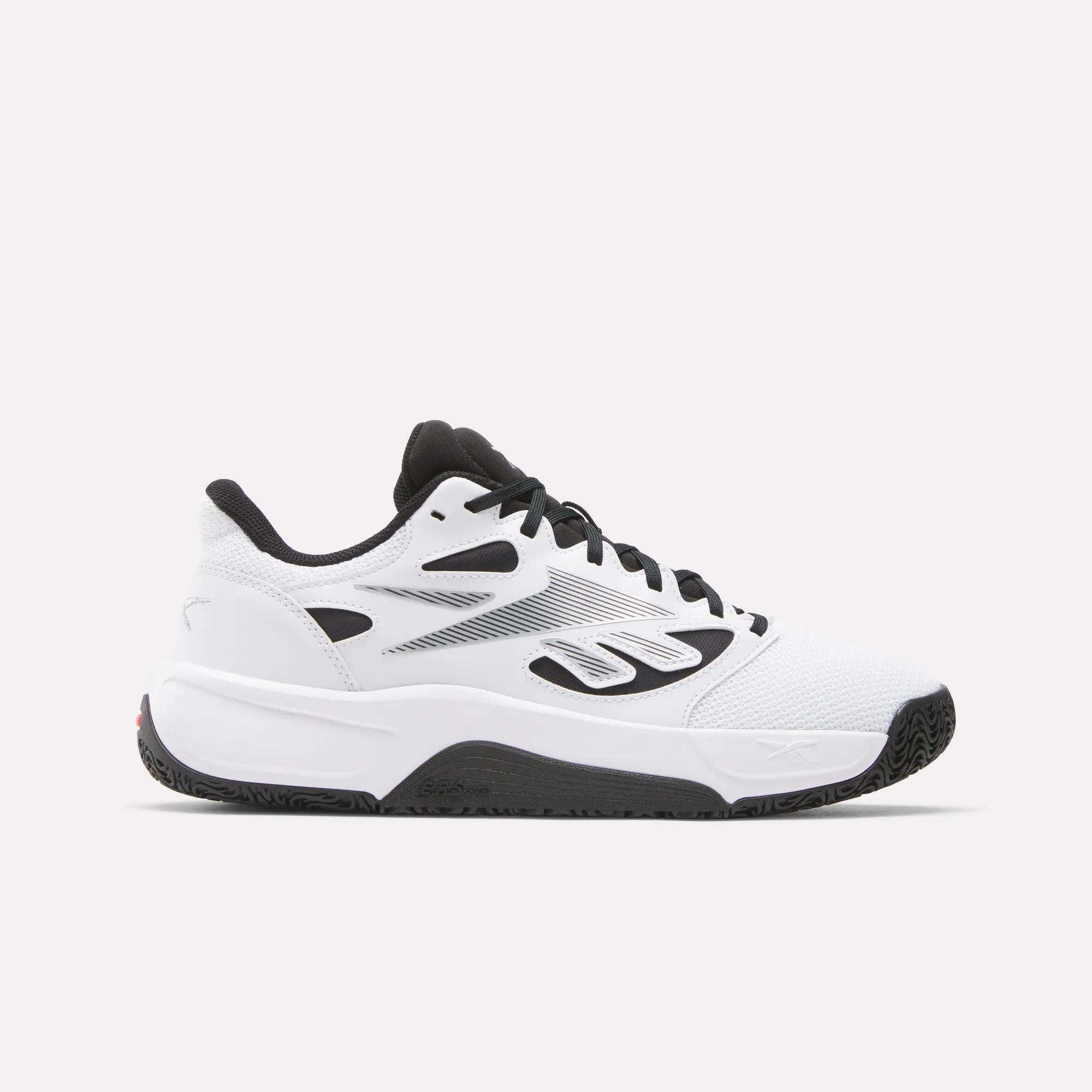 The Reebok Engine LT Shoes are white athletic sneakers with black and gray accents, black laces, a low-cut design, and a textured black sole, shown on a plain light background.