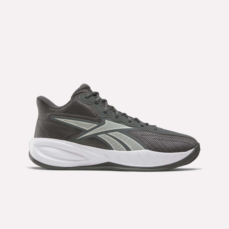 The Reebok Press Basketball Shoes are dark gray athletic sneakers with a white sole and a light gray side logo, featuring basketball heritage and EVA cushioning, displayed on a plain light background.