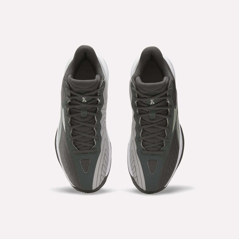 A pair of Reebok Press Basketball Shoes in dark gray and light gray are shown from above, highlighting their laces and classic basketball style against a plain white background.