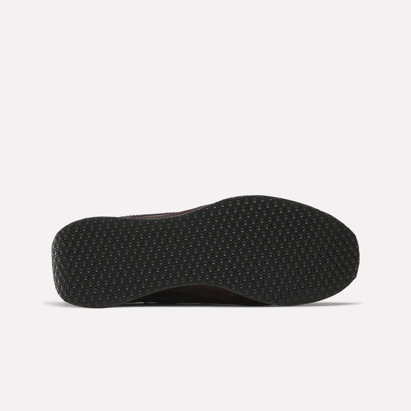 The image shows the bottom view of a Reebok Camargue x C.F. Stead Shoes sole, featuring a black hexagonal textured pattern on a white background—a durable archival style frequently combined with premium full-grain leather uppers.