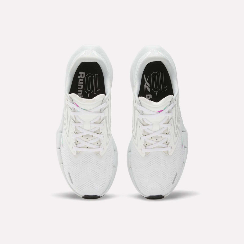 Top view of Reebok Women's FloatZig Tread Running Shoes featuring breathable mesh uppers, black soles, patterned laces, and a subtle zigzag design on a plain white background.