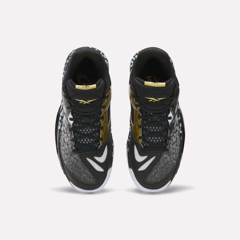 Top view of a pair of Reebok Engine A 26 Basketball Shoes in black with white and gold accents, featuring patterned toe and side panels, white outsoles, and ERS+ System cushioning for game-changing comfort.