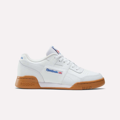 The Reebok Workout Plus Shoes - Big Kids is shown from the left in white with a gum sole, blue Reebok branding, and a small Union Jack flag—ideal sporty sneakers for kids who love classic style.