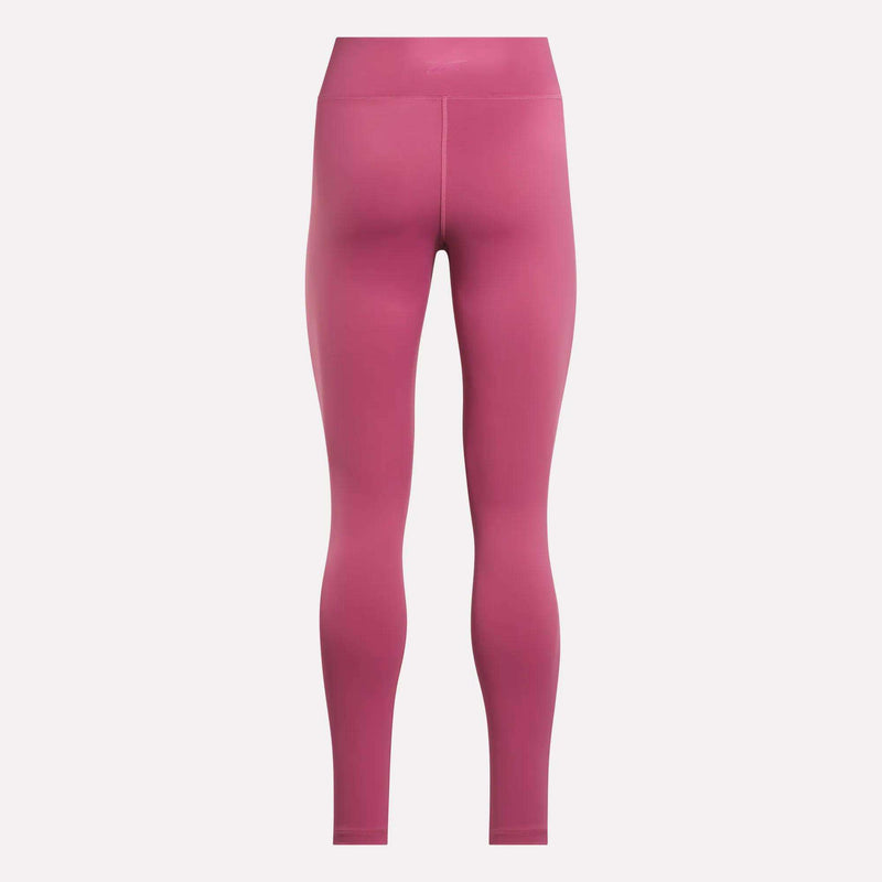 Rear view of Reebok Women's Lux-Lite High-Rise Tights in pink, full-length design, made with RBK-DRY performance fabric, displayed on a plain white background.
