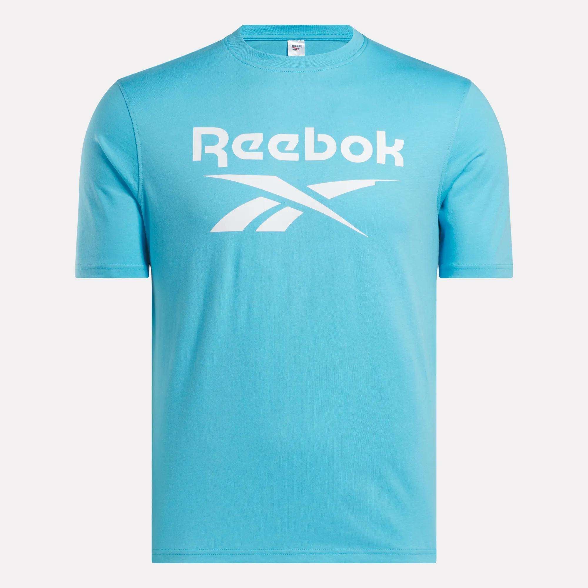 The Reebok Men's Big Logo Crewneck Short Sleeve Tee is a light blue t-shirt with a classic crewneck, short sleeves, and a bold white Reebok logo on the front—ideal for casual wear.