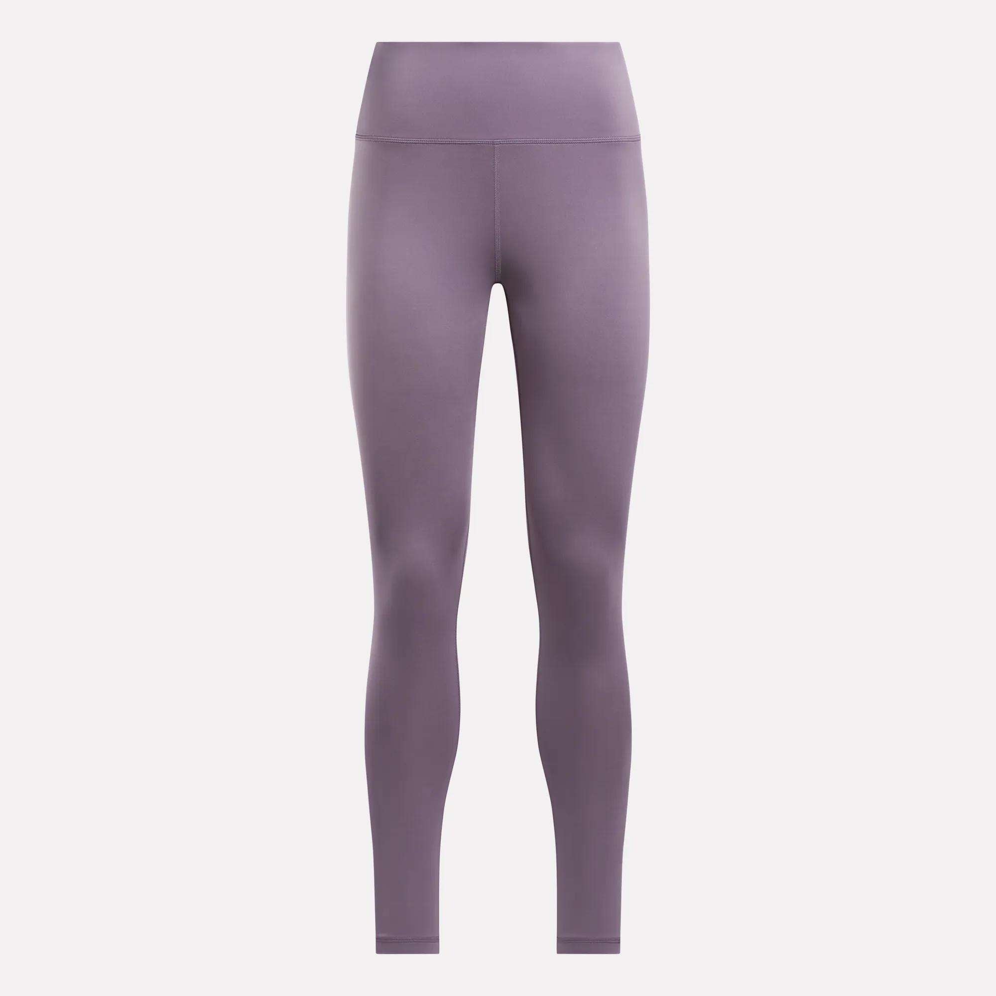 Reebok Women's Core High-Rise Leggings in solid mauve, made from RBK-DRY fabric, shown full-length against a plain light background.