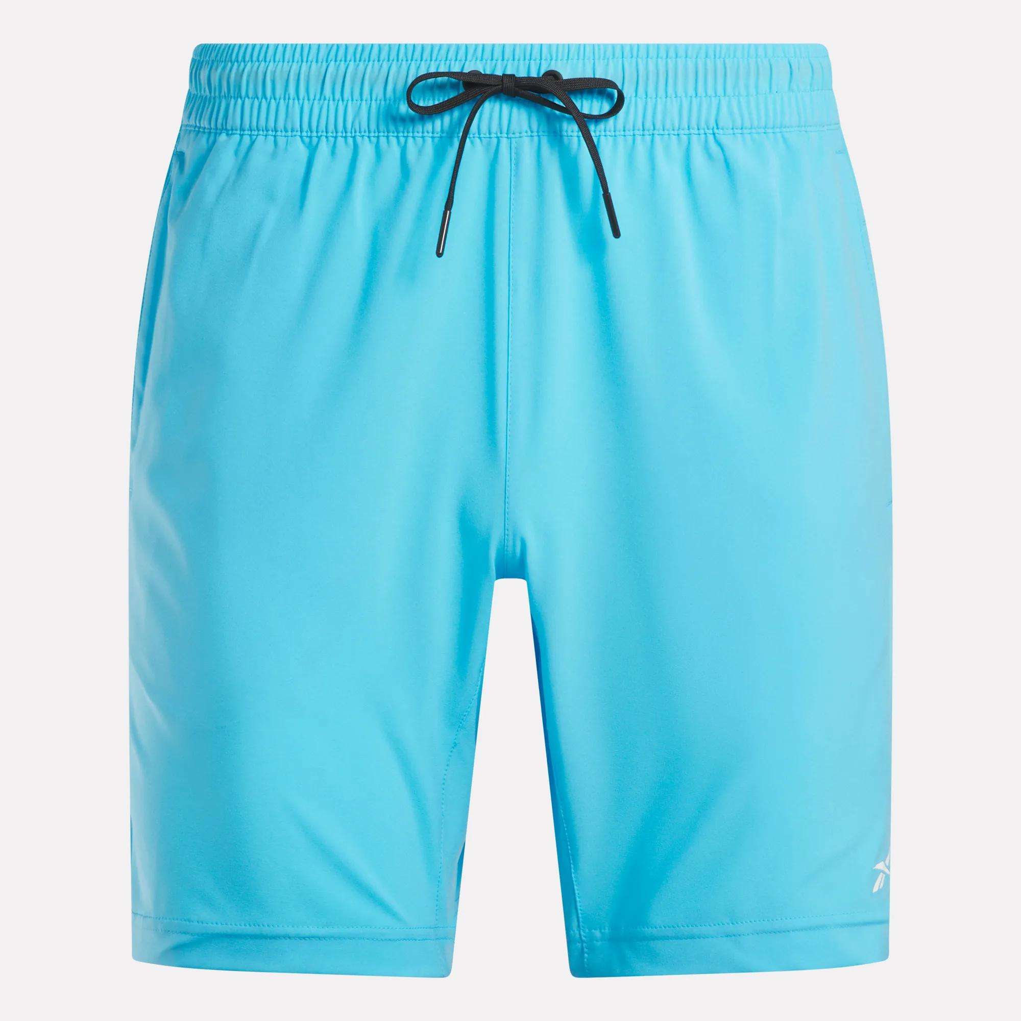 Men's Workout Ready Woven Shorts by Reebok in bright blue, featuring an elastic waistband with a black drawstring and a small white logo on the left leg. Sweat-wicking fabric. Displayed on a plain white background.