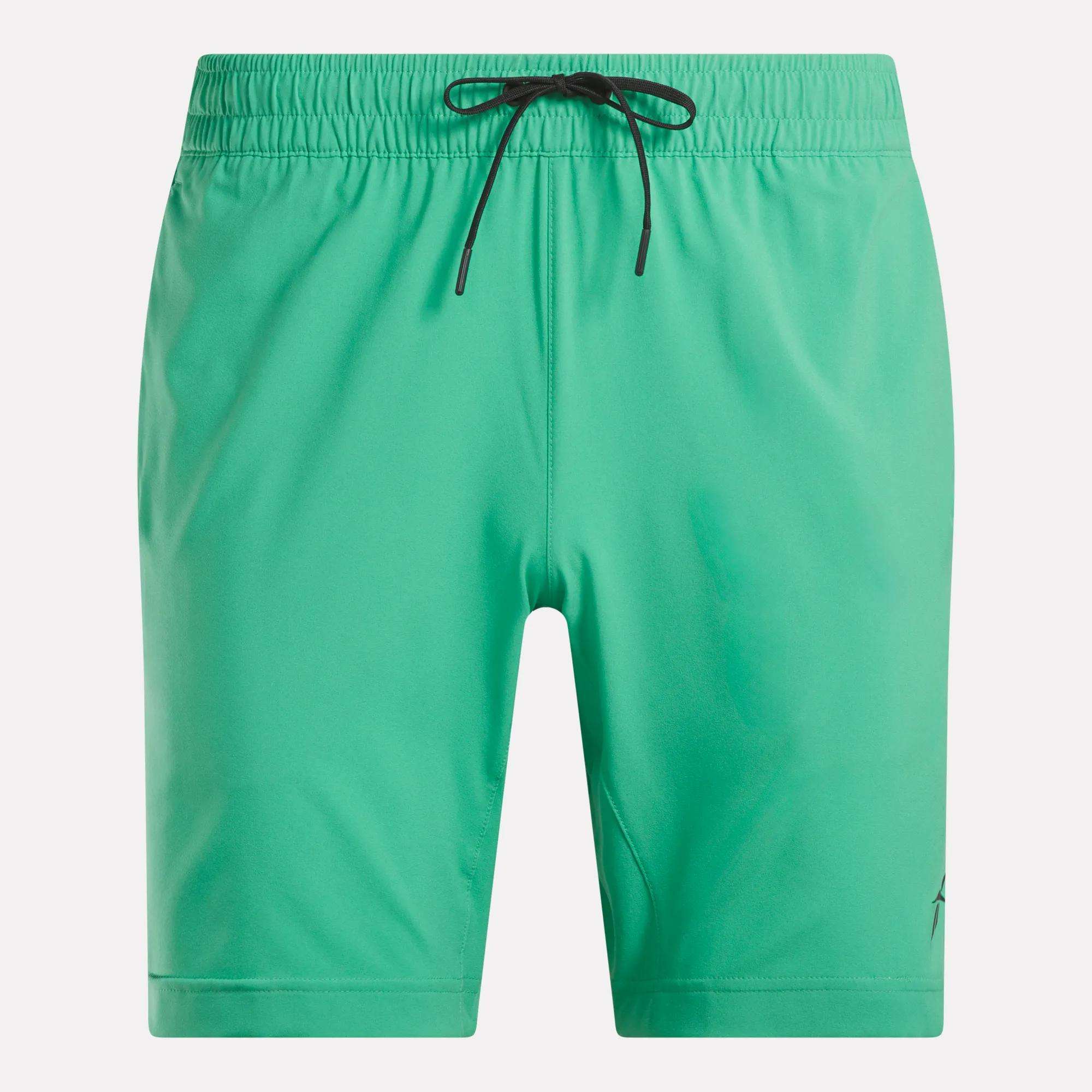 The Reebok Men's Workout Ready Woven Shorts feature a bright green design, elastic waistband, black drawstring, and small black logo near the hem. These plain workout shorts are perfect for sleek, sweat-wicking performance with no visible patterns or extra details.