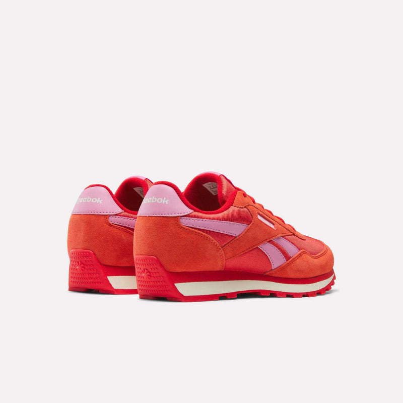 The Reebok Classic AZ Shoes for big kids feature a bright red suede and mesh upper with pink accents, white midsoles, and red outsoles—ideal for junior girls who want standout retro style.