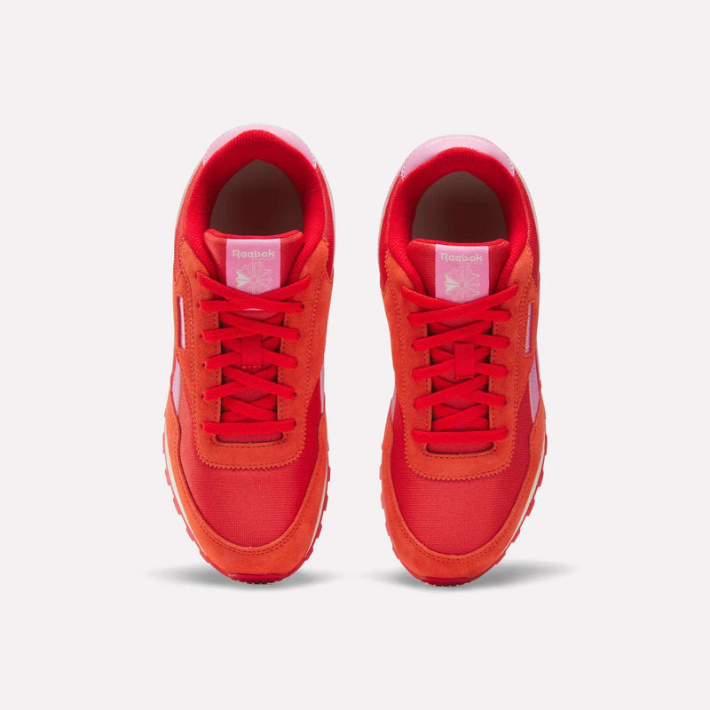 A top view of Reebok Classic AZ Shoes for big kids, featuring bright red uppers, white accents, red laces, and the Reebok logo on the tongue, shown on a white background.