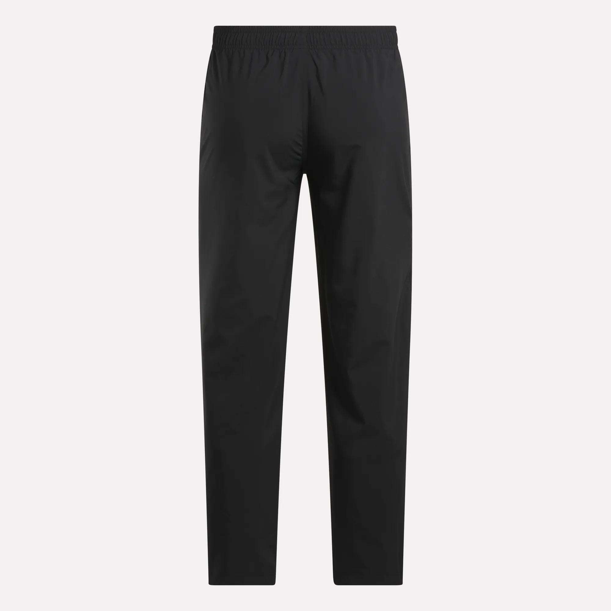 The Reebok Men's Train Woven Unlined Pants in black are lightweight workout pants, ideal for gym training, shown on a white background.