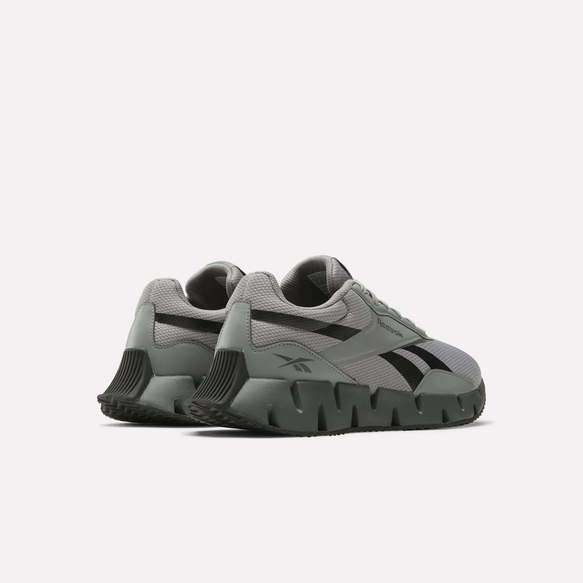The Reebok Zig Dynamica STR Shoes are gray running sneakers with chunky, sculpted soles, black accents, and EVA cushioning, shown from a rear side angle on a plain white background.