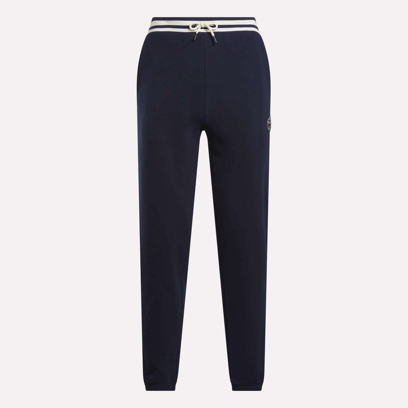 Men's Lawn Club French Terry Jogger Pants by Reebok in navy blue, featuring a white drawstring waist, white-striped waistband, and small circular logo on the left thigh, made from soft cotton-blend material. Displayed on a plain background.