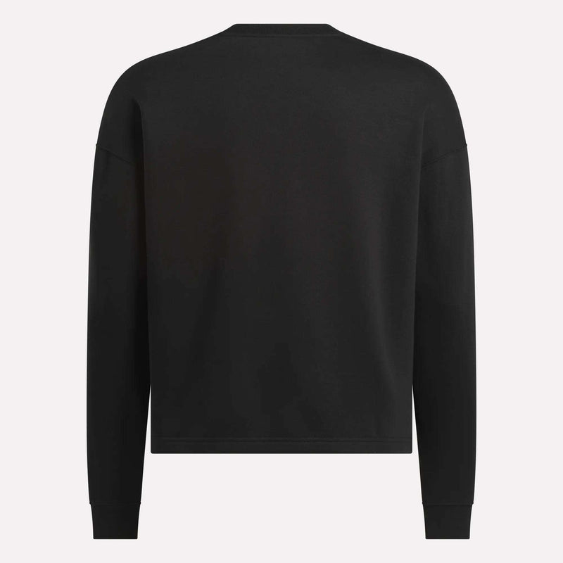 The Men's Wardrobe Essentials Sweatshirt by Reebok is shown from the back in black. This relaxed-fit, crew-neck style is made from soft cotton-blend fleece, with no visible logos, patterns, or fastenings.