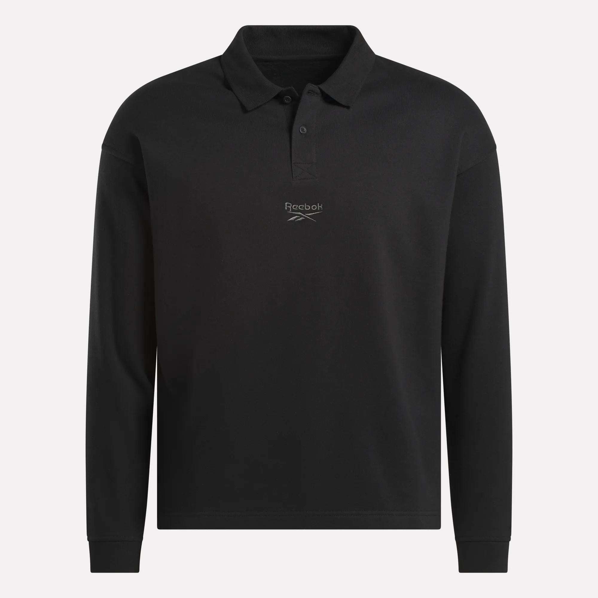 The Reebok Men's Wardrobe Essentials Long Sleeve Polo Shirt features a relaxed fit, collar with buttons, and a white Reebok logo on the chest, crafted from a soft cotton-blend for all-day comfort.