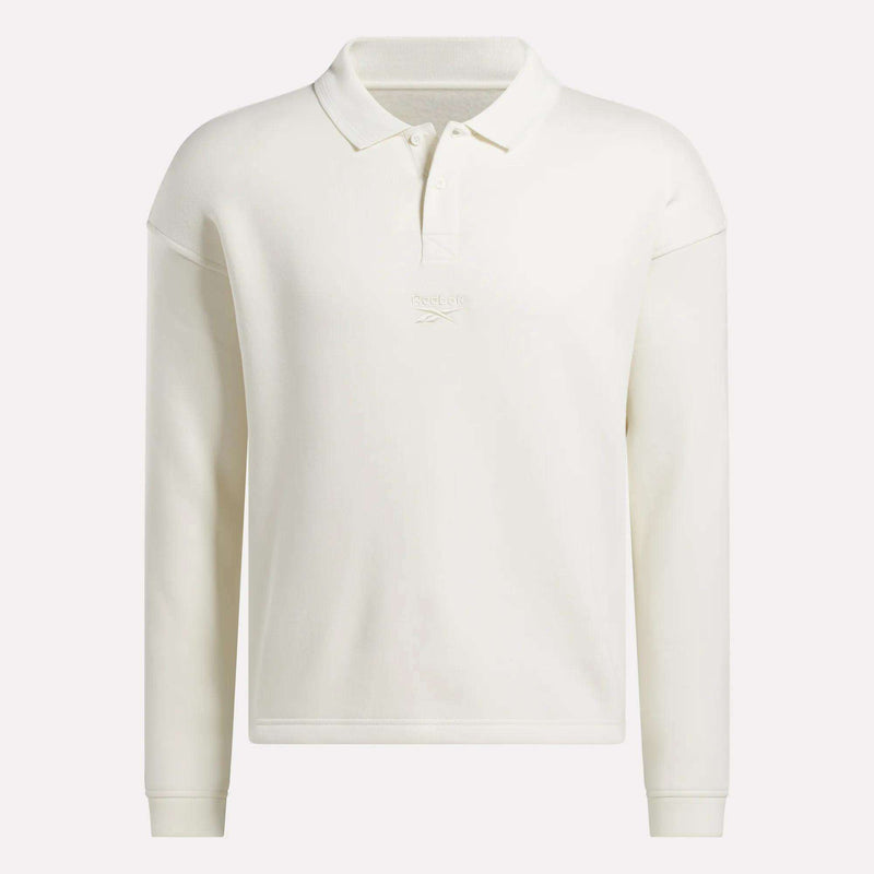 The Men's Wardrobe Essentials Long Sleeve Polo Shirt by Reebok features a collar, button placket, and subtle chest embroidery. Made from a cotton blend, this off-white polo offers a classic, simple look.