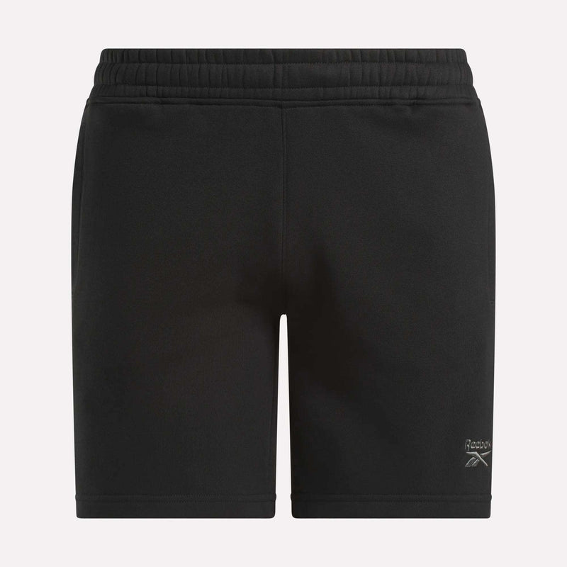 Men's Wardrobe Essentials Shorts by Reebok—black fleece shorts with an elastic waistband, white Reebok logo on the lower left leg, and a relaxed fit, shown against a plain white background.