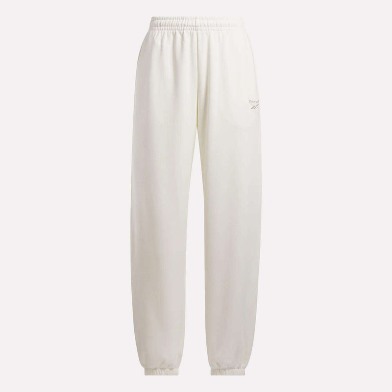 The Reebok Women's Lawn Club Jogger Pants feature a white fleece design with an elastic waistband and cuffs, plus a small embroidered logo on the upper left thigh—perfect for those seeking classic, minimalist women's joggers.