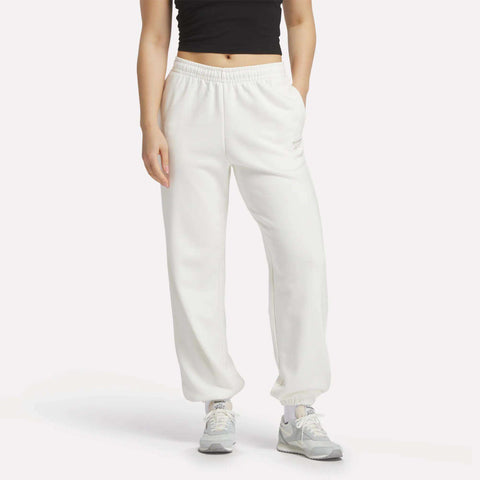A person wearing Reebok Women's Lawn Club Jogger Pants in white.