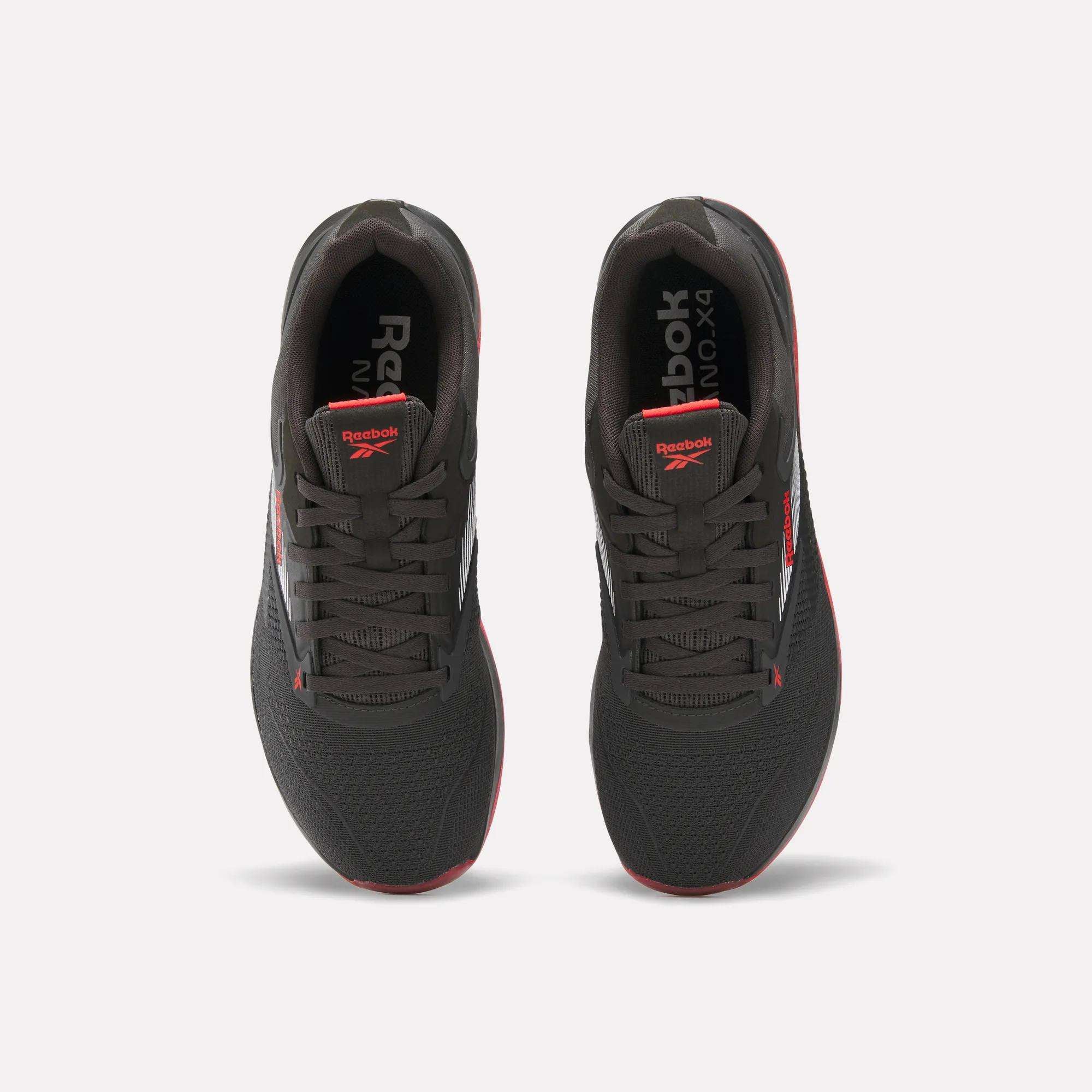 A pair of black Reebok Nano X4 Training Shoes with red accents and white branding shown from above on a plain white background.