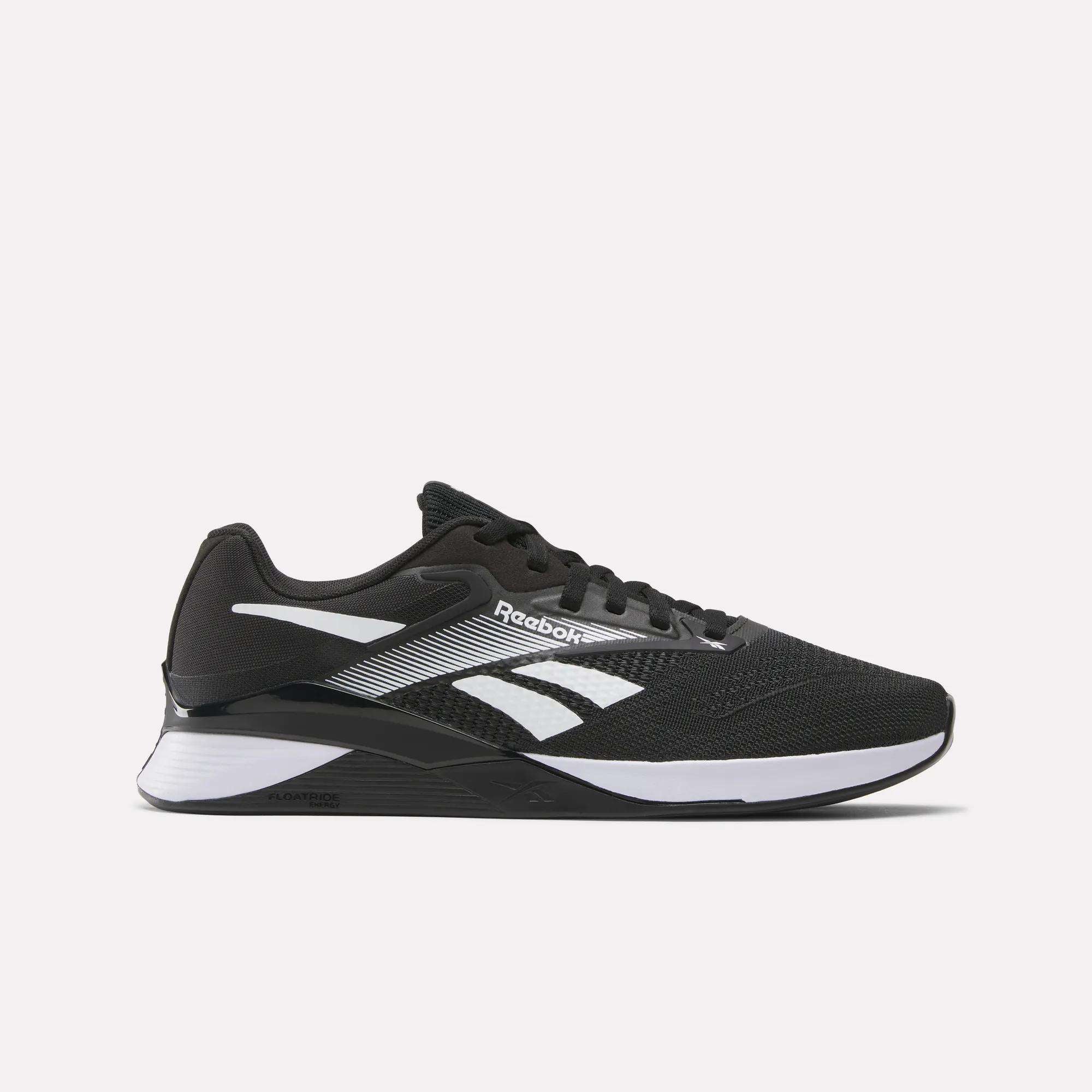 The Reebok Nano X4 Training Shoes in black feature white and silver accents, the Reebok logo on the side, and a thick white-and-black Flexweave sole, shown in side profile against a plain white background.