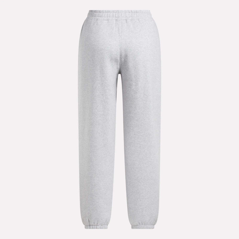 The Reebok Women's Wardrobe Essentials Sweat Pants are light gray with an elastic waistband and ankle cuffs, made from soft fleece, and shown against a plain white background.