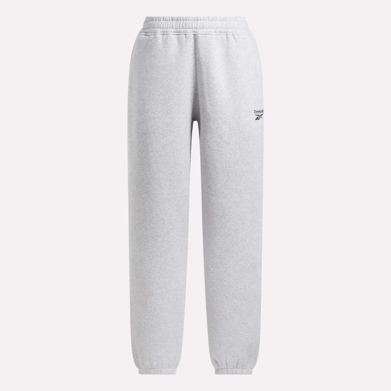 The Reebok Women's Wardrobe Essentials Sweat Pants in light gray feature an elastic waistband and cuffs, a small logo on the upper left thigh, and are shown against a plain white background.