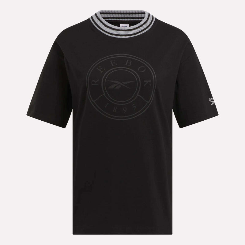 The Women's Lawn Club T-Shirt by Reebok features short sleeves, a black, white, and gray striped round collar, a circular Lawn Club 1895 logo on the front, and a small Reebok logo on the left sleeve—perfect for everyday wear.