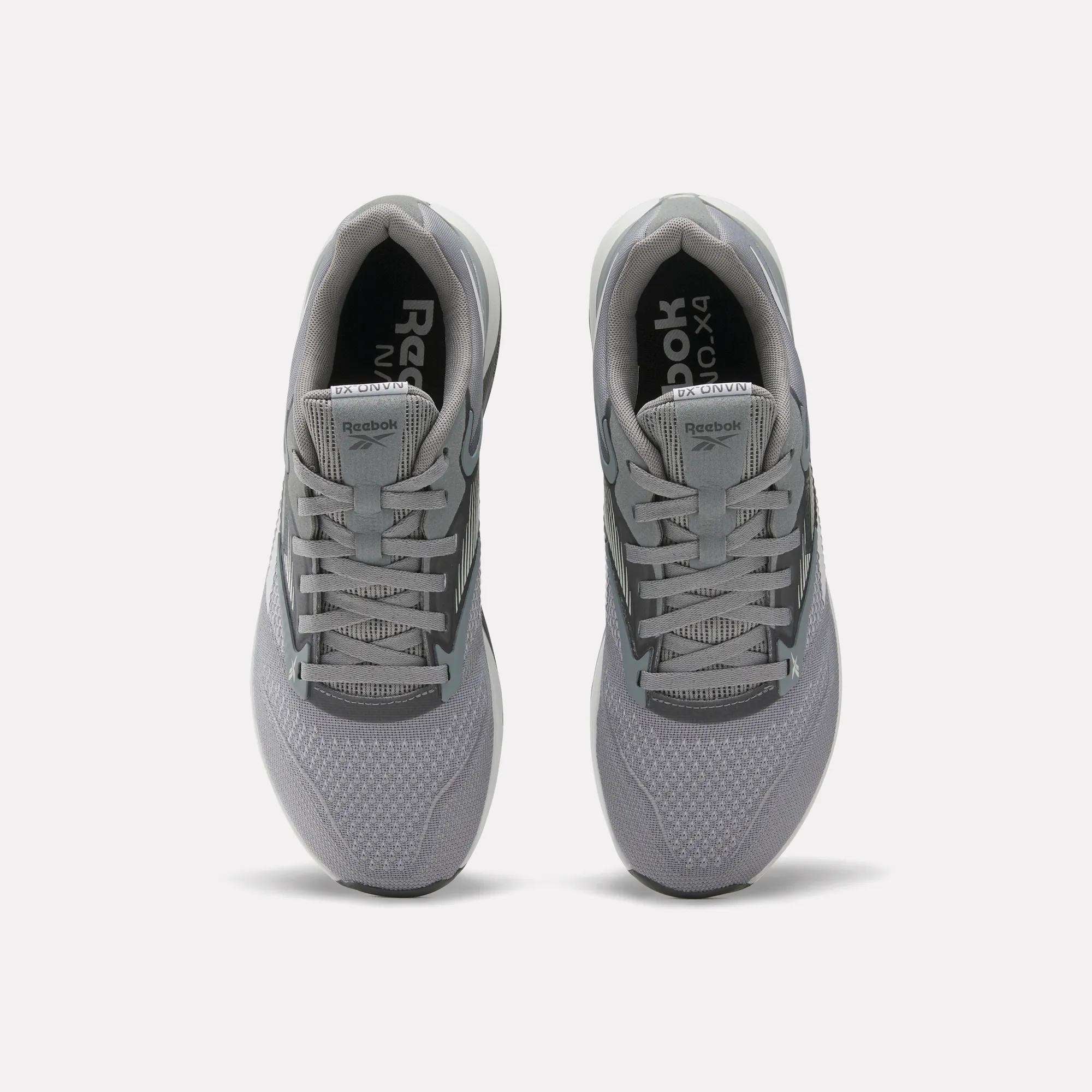 A pair of gray Reebok Nano X4 Training Shoes seen from above, showing the laces, mesh texture, and Reebok branding on the tongue and insole, featuring Floatride Energy Foam for enhanced comfort.