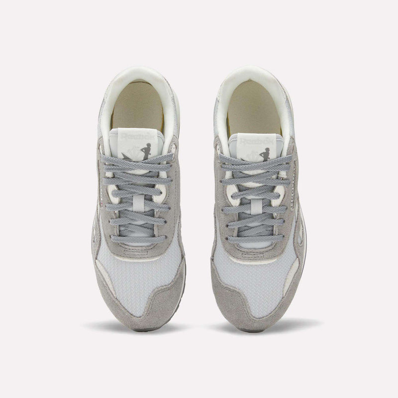 The Reebok Women's Classic Nylon 89 Shoes, shown in gray and white with white laces on a plain background, feature a retro design ideal for women's running.